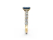 Shared-Prong Engagement Ring Setting for Fancy Blue Emerald Cut Center with Graduated Accents and Prong Head in Yellow Gold