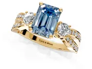 3 Stone Engagement Ring Setting for Fancy Blue Emerald Cut Center with Pave Twist Band and Prong Head in Yellow Gold