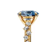 Solitaire Engagement Ring Setting for Fancy Blue Oval Center with Trailing Leaf Accent Band and Prong Head in Yellow Gold