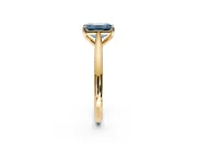 Solitaire Engagement Ring Setting for Fancy Blue Emerald Cut Center with Narrow Cathedral Band and Prong Head in Yellow Gold
