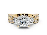 3 Stone Engagement Ring Setting for Cushion Cut Center with Pave Twist Band and Prong Head in Yellow Gold