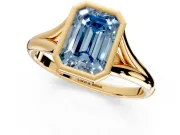 Solitaire Engagement Ring Setting for Fancy Blue Emerald Cut Center with V Split Shank and Bezel Head in Yellow Gold