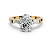 3 Stone Engagement Ring Setting for Oval Center with Channel Baguette Accents and Prong Head in Yellow Gold