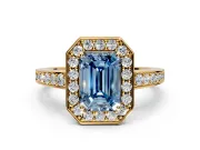 Bezel-Framed Halo Engagement Ring Setting for Fancy Blue Emerald Cut Center with Pave Band and Prong Head in Yellow Gold