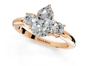 3 Stone Engagement Ring Setting for Pear-Shaped Center with Wide Plain Band and Prong Head in Rose Gold