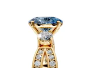 3 Stone Engagement Ring Setting for Fancy Blue Oval Center with Pave Twist Band and Prong Head in Yellow Gold