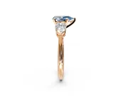 3 Stone Engagement Ring Setting for Fancy Blue Pear-Shaped Center with Large Pear-Shaped Accents and Prong Head in Rose Gold