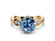 Solitaire Engagement Ring Setting for Fancy Blue Round Cut Center with Accented Twist Band and Leaf Prong Head in Yellow Gold