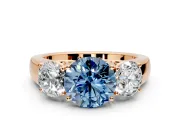 3 Stone Engagement Ring Setting for Fancy Blue Round Cut Center with Raised Basket Heads and Prong Head in Rose Gold