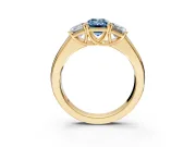 3 Stone Engagement Ring Setting for Fancy Blue Emerald Cut Center with Raised Basket Heads and Prong Head in Yellow Gold