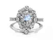 Milgrain Halo Engagement Ring Setting for Pear-Shaped Center with Bezel Point Accents and Prong Head in Sterling Silver