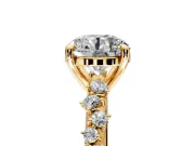 Solitaire Engagement Ring Setting for Round Cut Center with Trailing Leaf Accent Band and Prong Head in Yellow Gold