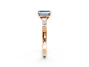 3 Stone Engagement Ring Setting for Fancy Blue Asscher Cut Center with Tapered Baguettes, Plain Band and Prong Head in Rose Gold