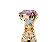 3 Stone Engagement Ring Setting for Fancy Pink Heart-Shaped Center with Pave Twist Band and Prong Head in Yellow Gold