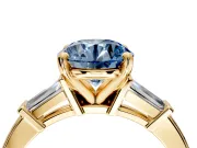 3 Stone Engagement Ring Setting for Fancy Blue Round Cut Center with Channel Baguette Accents and Prong Head in Yellow Gold
