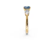 3 Stone Engagement Ring Setting for Fancy Blue Cushion Cut Center with Large Pear-Shaped Accents and Prong Head in Yellow Gold