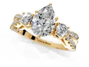 3 Stone Engagement Ring Setting for Pear-Shaped Center with Pave Split Shank and Prong Head in Yellow Gold