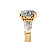 3 Stone Engagement Ring Setting for Round Cut Center with Channel Baguette Accents and Prong Head in Yellow Gold