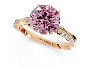 Side Accent Engagement Ring Setting for Fancy Pink Round Cut Center with Accent Shoulders and Prong Head in Rose Gold