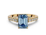 Solitaire Engagement Ring Setting for Fancy Blue Emerald Cut Center with Crossover Accents and Prong Head in Yellow Gold