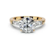 3 Stone Engagement Ring Setting for Round Cut Center with Tapered Baguettes, Plain Band and Prong Head in Yellow Gold