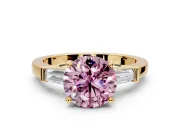 3 Stone Engagement Ring Setting for Fancy Pink Round Cut Center with Channel Baguette Accents and Prong Head in Yellow Gold