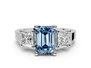 3 Stone Engagement Ring Setting for Fancy Blue Emerald Cut Center with Matching Side Accents and Prong Head in Platinum