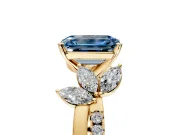 Floral Engagement Ring Setting for Fancy Blue Emerald Cut Center with Trailing Marquise Accents and Prong Head in Yellow Gold