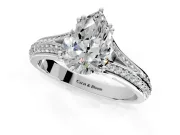 Solitaire Engagement Ring Setting for Pear-Shaped Center with Pave Rail Split Shank and Prong Head in Platinum