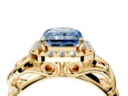 Halo Engagement Ring Setting for Fancy Blue Radiant Cut Center with Open Scroll Shoulders and Prong Head in Yellow Gold