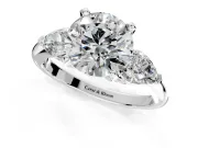 3 Stone Engagement Ring Setting for Round Cut Center with Large Pear-Shaped Accents and Prong Head in Platinum