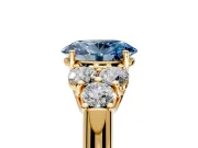 Cluster Engagement Ring Setting for Fancy Blue Oval Center with Round Cut Accent Frame and Prong Head in Yellow Gold