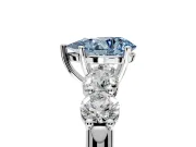 5 Stone Engagement Ring Setting for Fancy Blue Pear-Shaped Center with Graduated Accents and Prong Head in White Gold