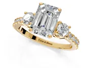 3 Stone Engagement Ring Setting for Emerald Cut Center with Round Cut Side Accents and Prong Head in Yellow Gold