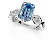 Solitaire Engagement Ring Setting for Fancy Blue Emerald Cut Center with Accented Twist Band and Leaf Prong Head in Platinum